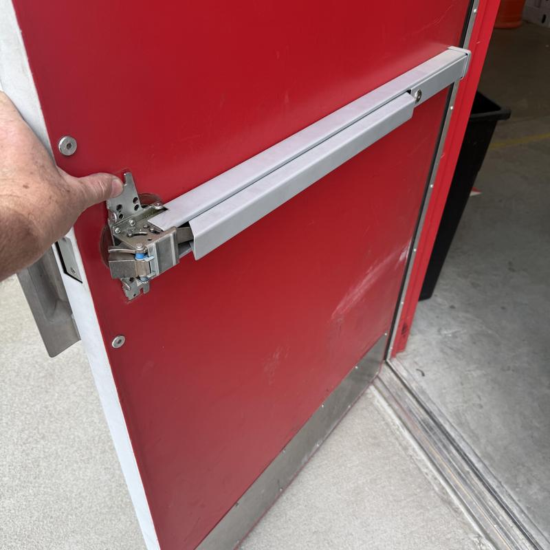 Exit bar fastener installation on red door