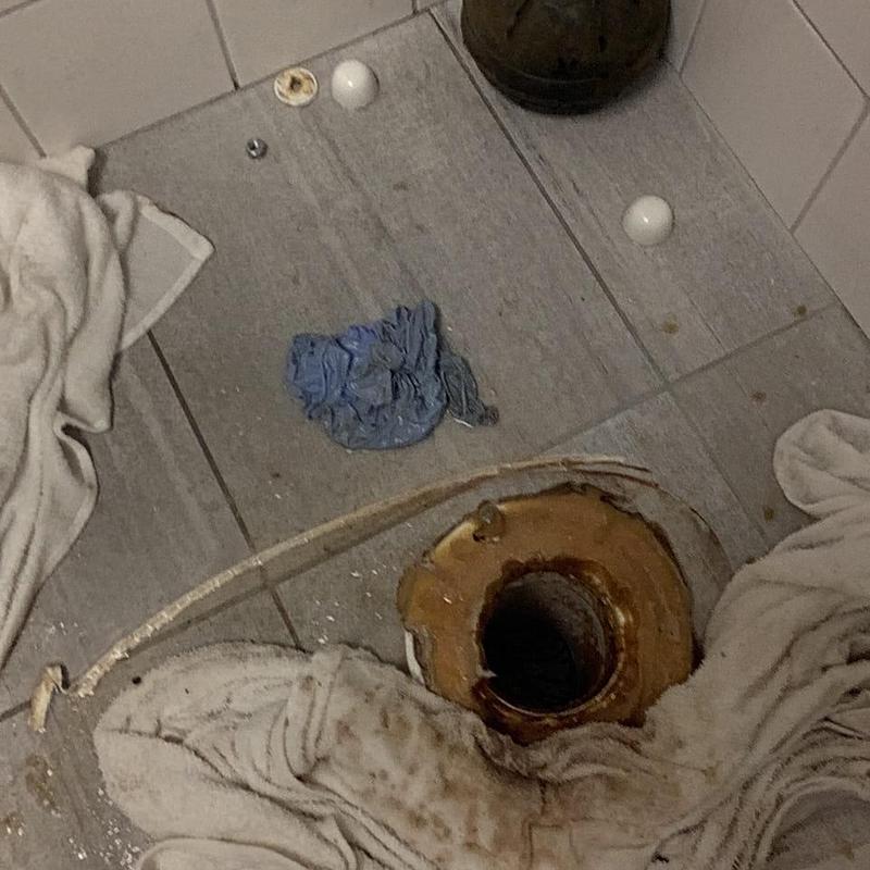 Toilet flange and drain pipe with removed commode parts