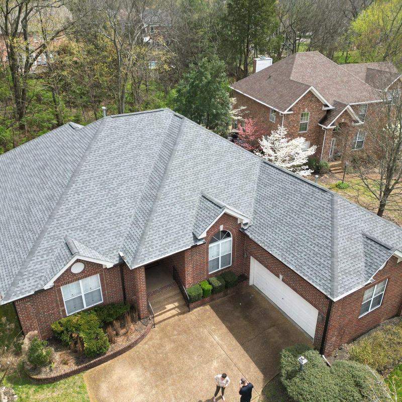 Impact-resistant roof shingles with ridge cap reinforcement