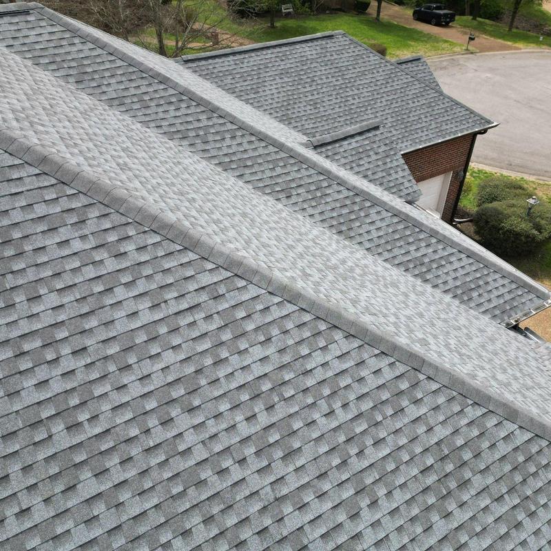Asphalt shingle roof with hail and wind damage