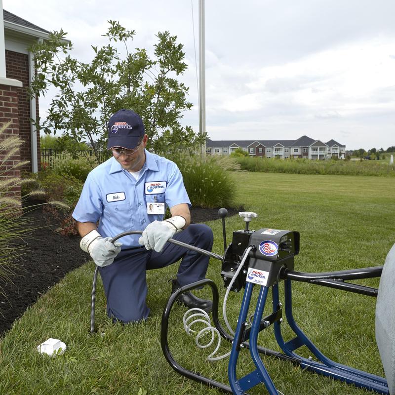 Main sewer line with drain cleaning machine outdoors