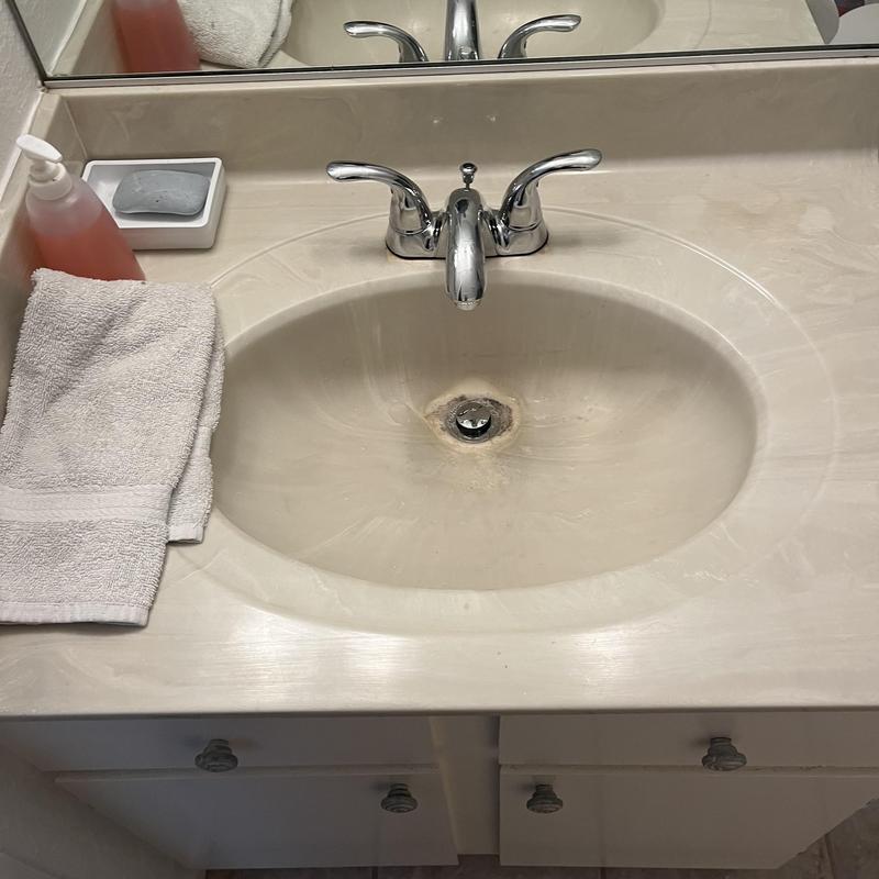 Bathroom sink faucet with soap dispenser and towel