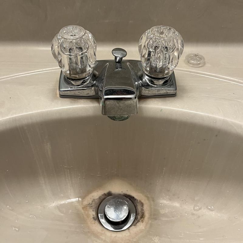 Lab faucet with dual knobs and stained sink basin