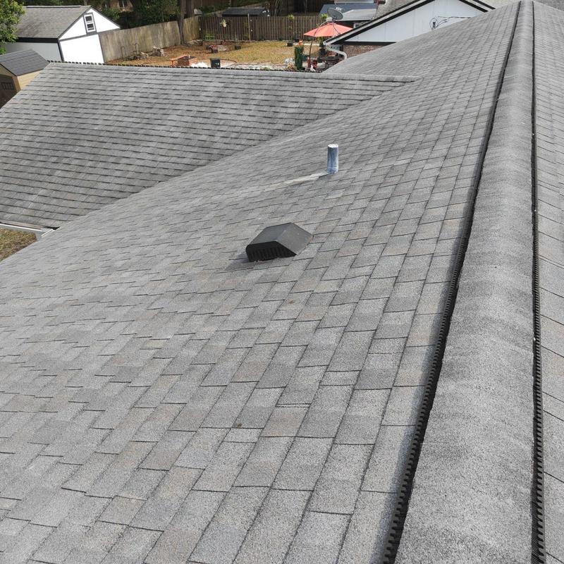 Asphalt shingle roof with plumbing vent and roof vent Asphalt shingle roof with plumbing vent and roof vent