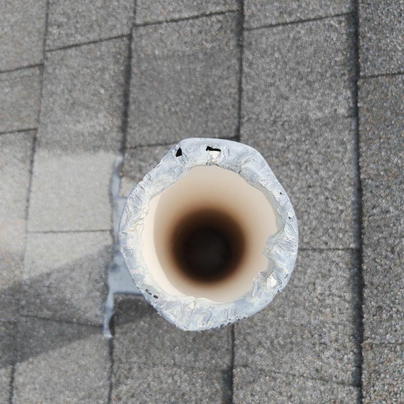 Plumbing vent pipe with squirrels protector holes on roof Plumbing vent pipe with squirrels protector holes on roof