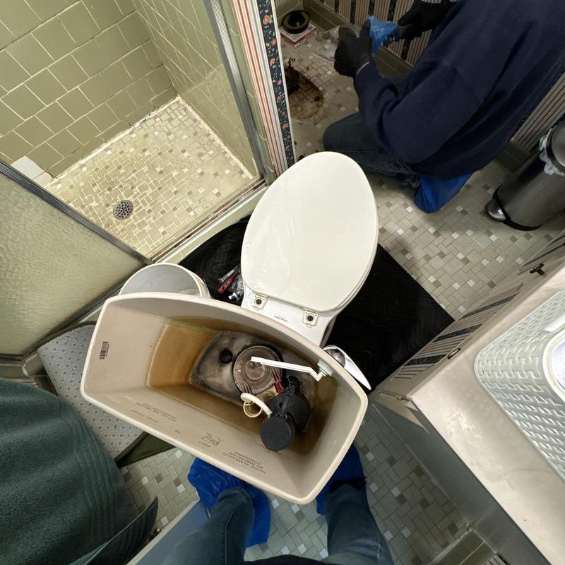Kohler toilet tank interior during installation