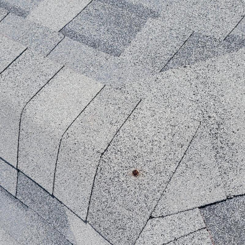 Shingle ridge vent with sealed and aligned shingles
