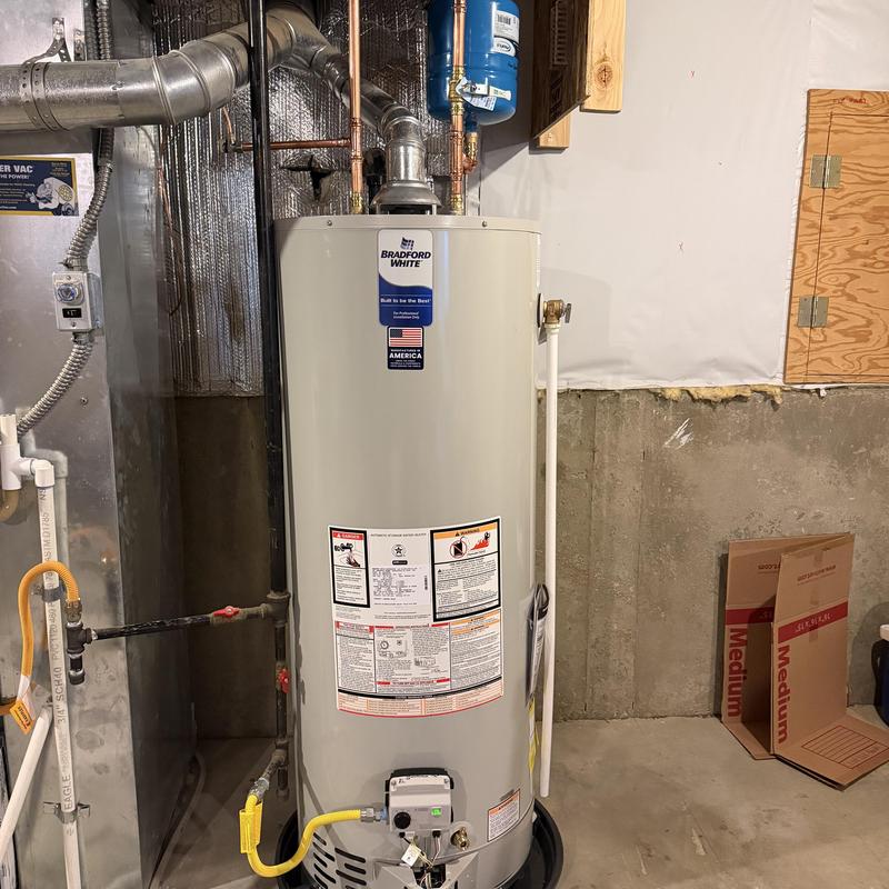 Bradford White water heater with vent and piping
