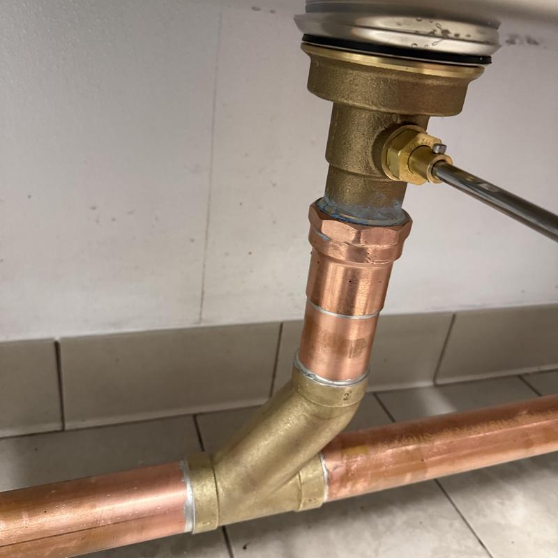 Copper drain pipe assembly with brass fitting and valve