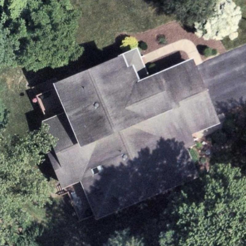 Roof shingles aerial view with surrounding trees