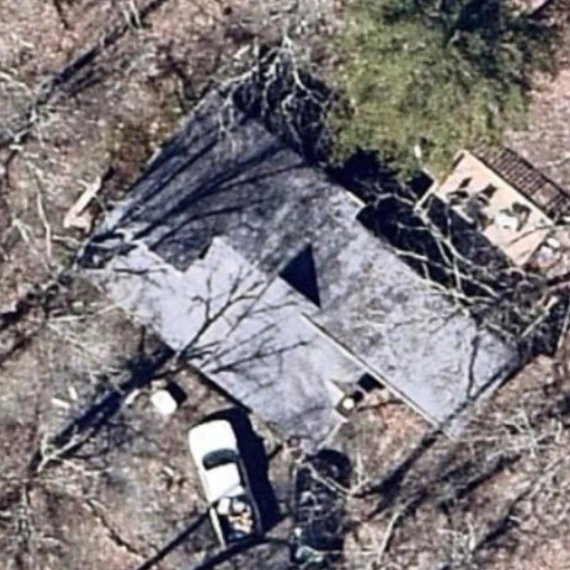 Roof shingles inspection on residential home in forest area