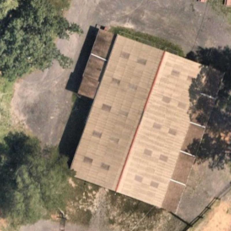 Roof shingles condition aerial view with surrounding trees