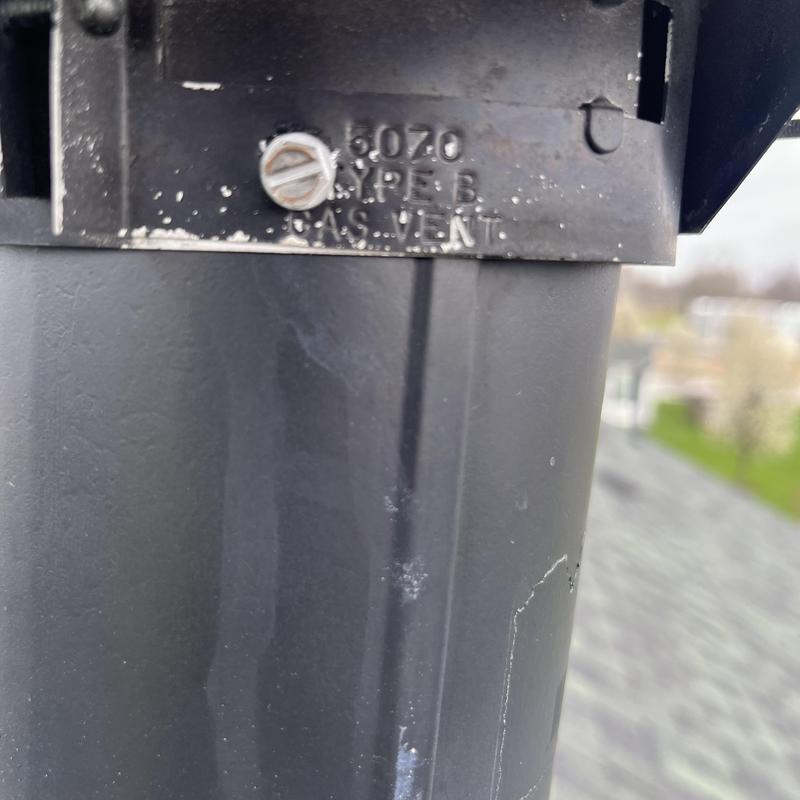 Gas vent pipe on HVAC stack with Type B label Gas vent pipe on HVAC stack with Type B label