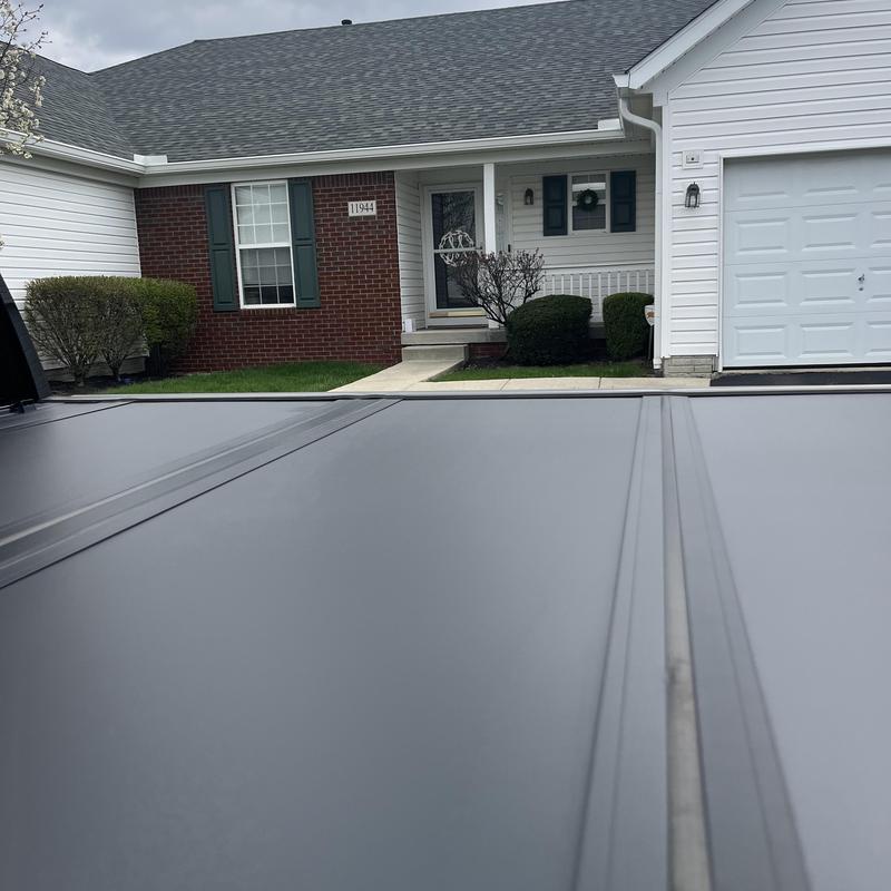 Metal roof panel close-up at residential house exterior Metal roof panel close-up at residential house exterior