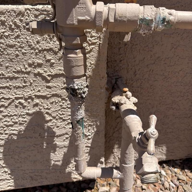 Corroded backyard hose bib and pressure vacuum breaker