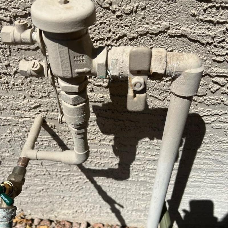 Vacuum breaker ball valve and PVC pipe fittings outdoors