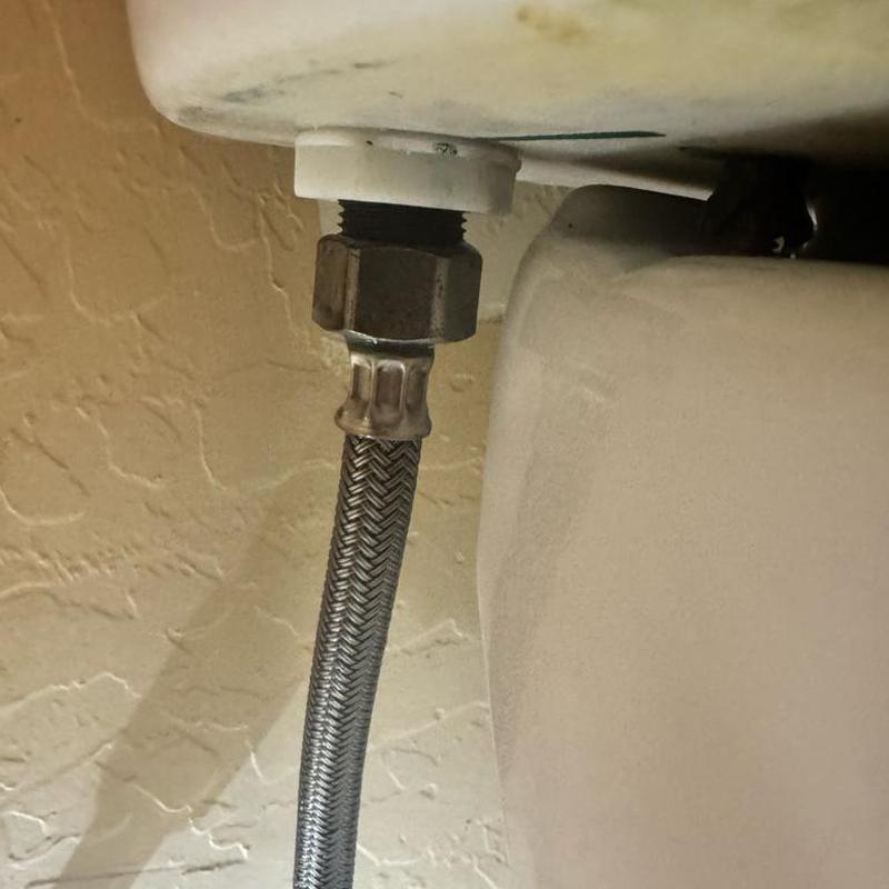 Toilet supply line and angle stop connection in bathroom