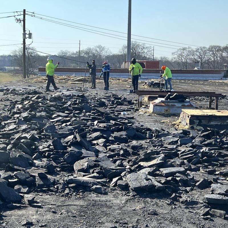 Tear-off of old two-layer roofing on industrial roof