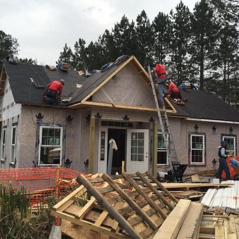 Asphalt shingle roof installation on residential house