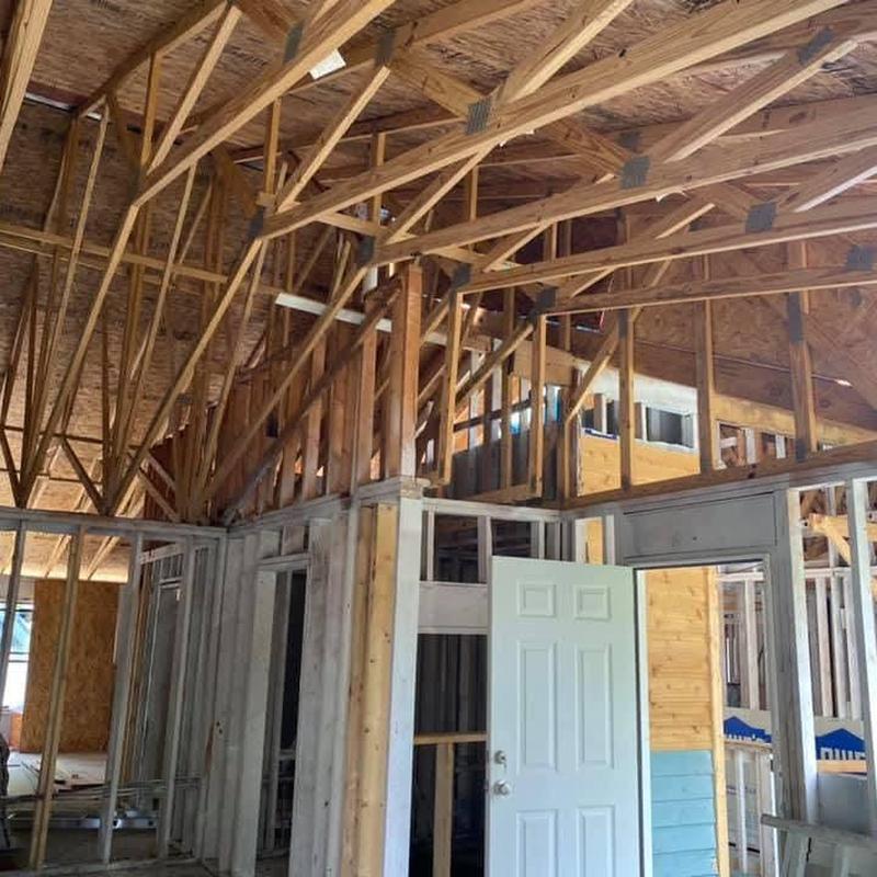 Roof trusses installation in house frame interior