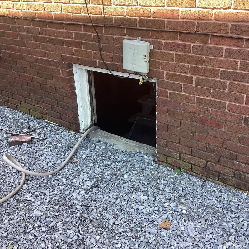 Cleanout pipe jetting through basement window opening