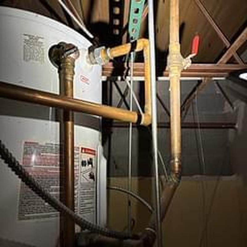 Water heater pipes and valves in ceiling space