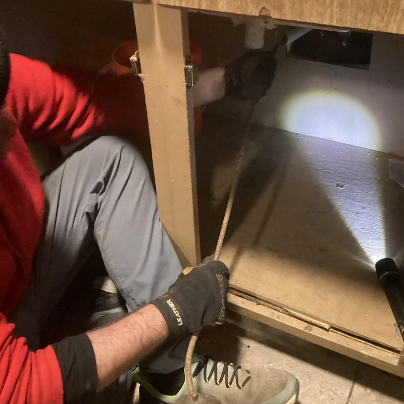 Kitchen sink line clogged with old grease buildup cleaning