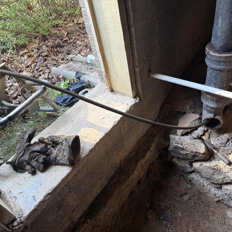 Mainline sewer cable snaking from foundation cleanout
