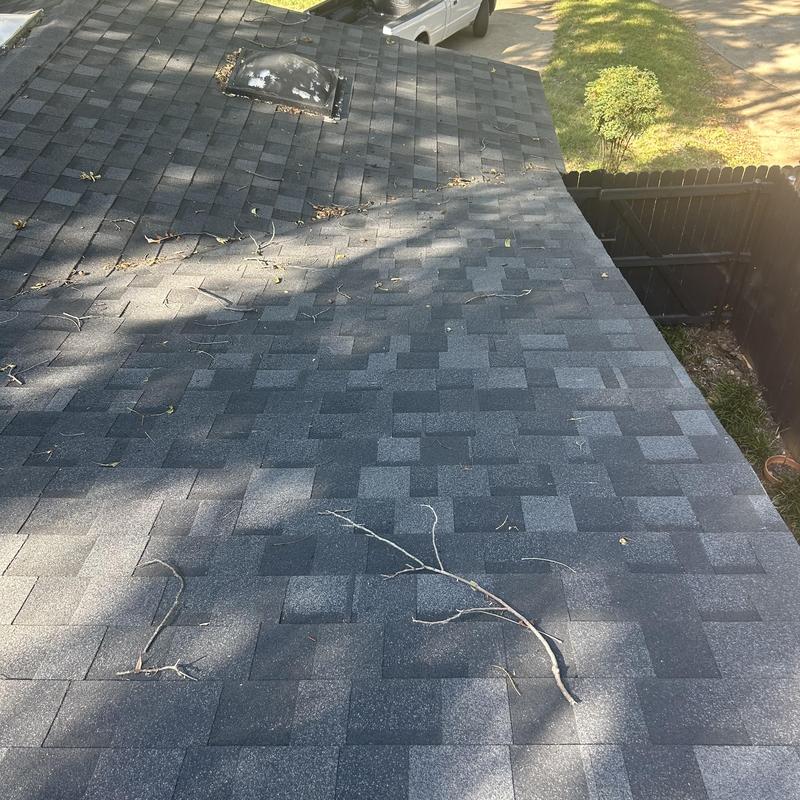 Asphalt shingle roof with vent and debris after inspection