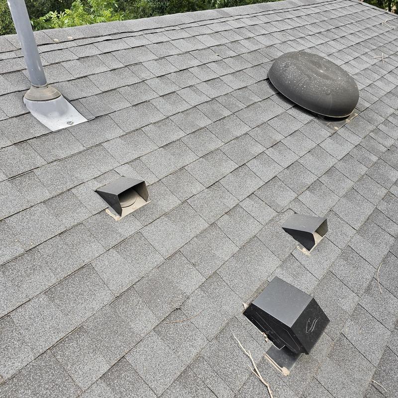 Asphalt shingle roof with hail damage and vents