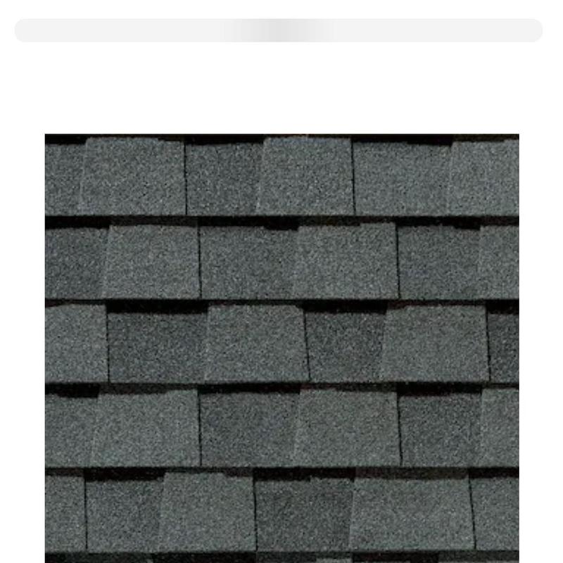 Asphalt shingle roof with hail damage close-up