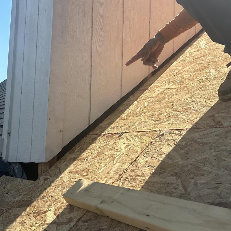 Chimney base with missing supportive decking on roof