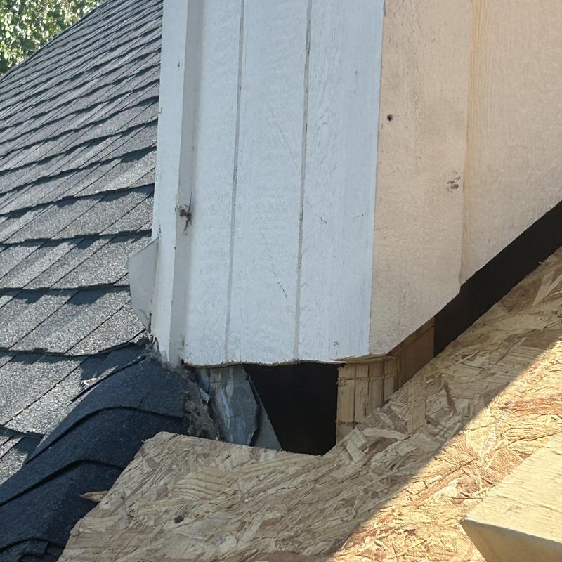 Chimney base missing flashing and decking on roof