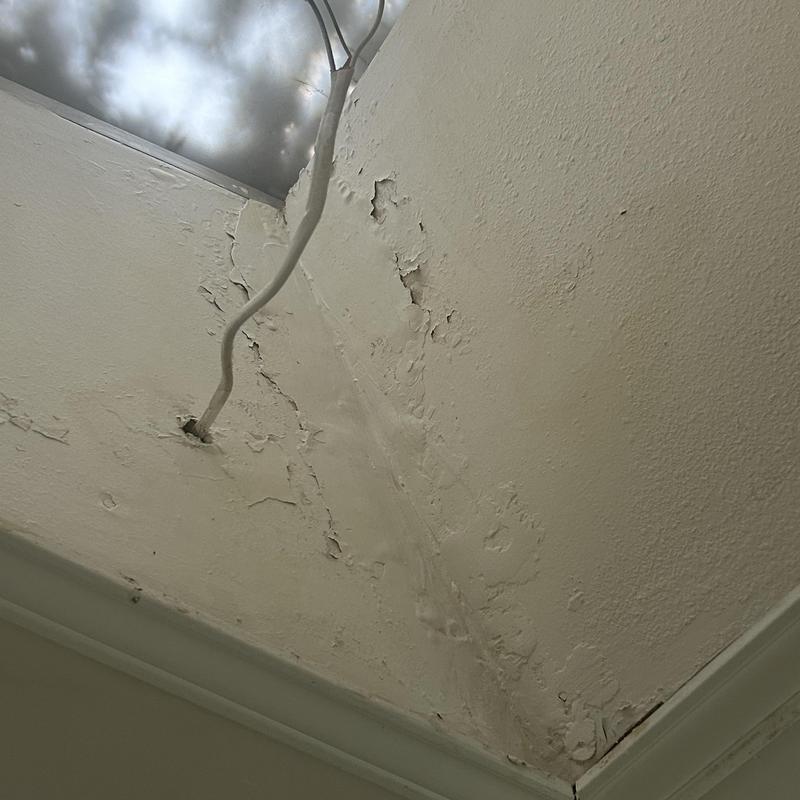 Ceiling water damage from missing chimney decking