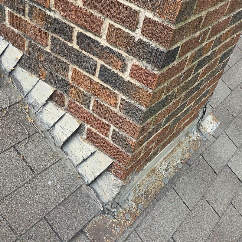 Chimney flashing and roof shingle hail damage