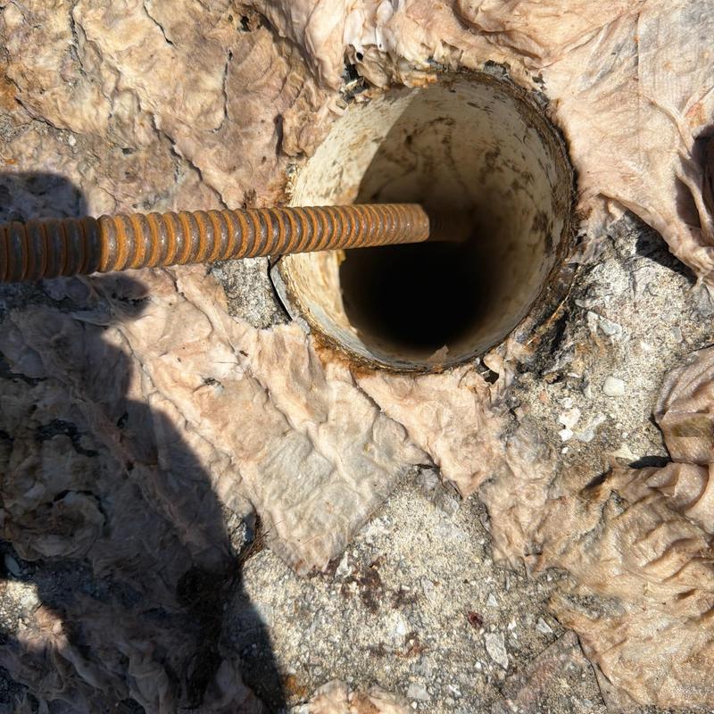 Main sewer line cable inserted into cleanout pipe