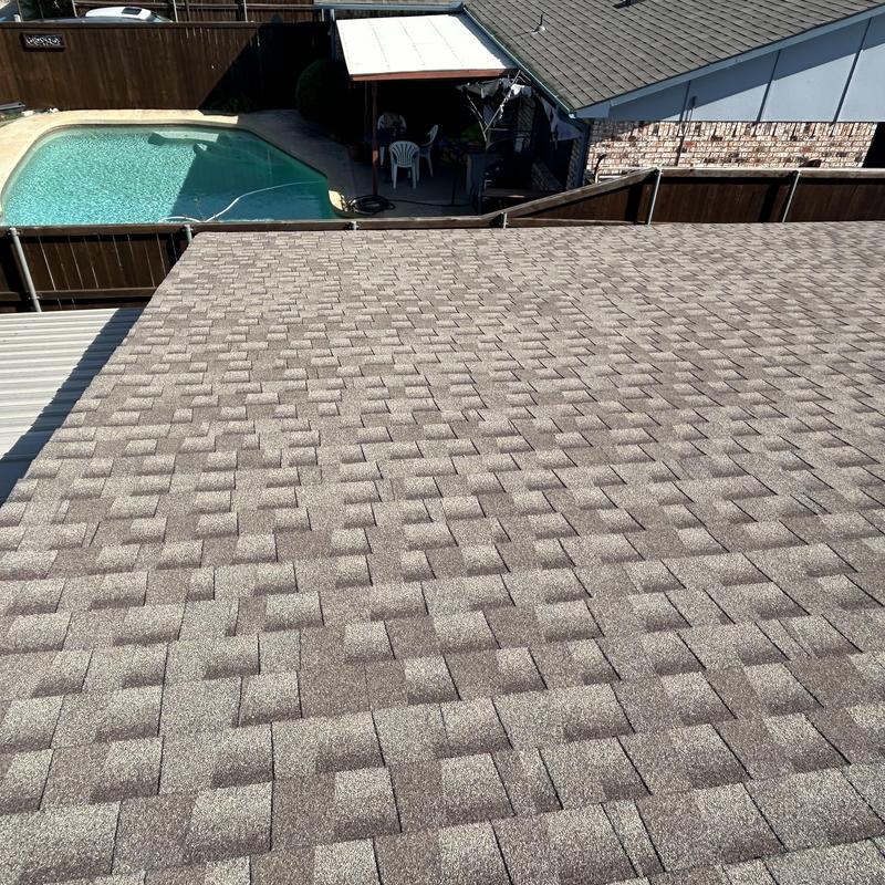 Asphalt shingle roof over backyard pool and patio in Fort Worth