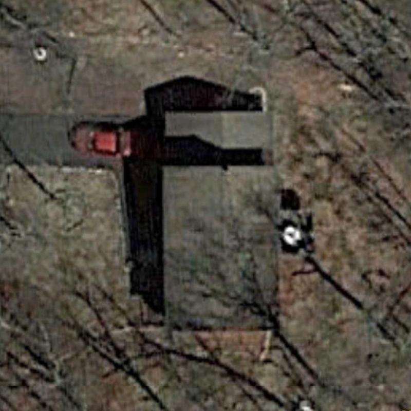 Residential roof aerial inspection with driveway and vehicle