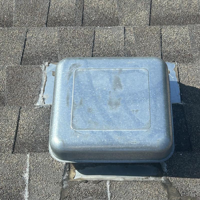 Roof vent cover and surrounding shingle repair on asphalt roof