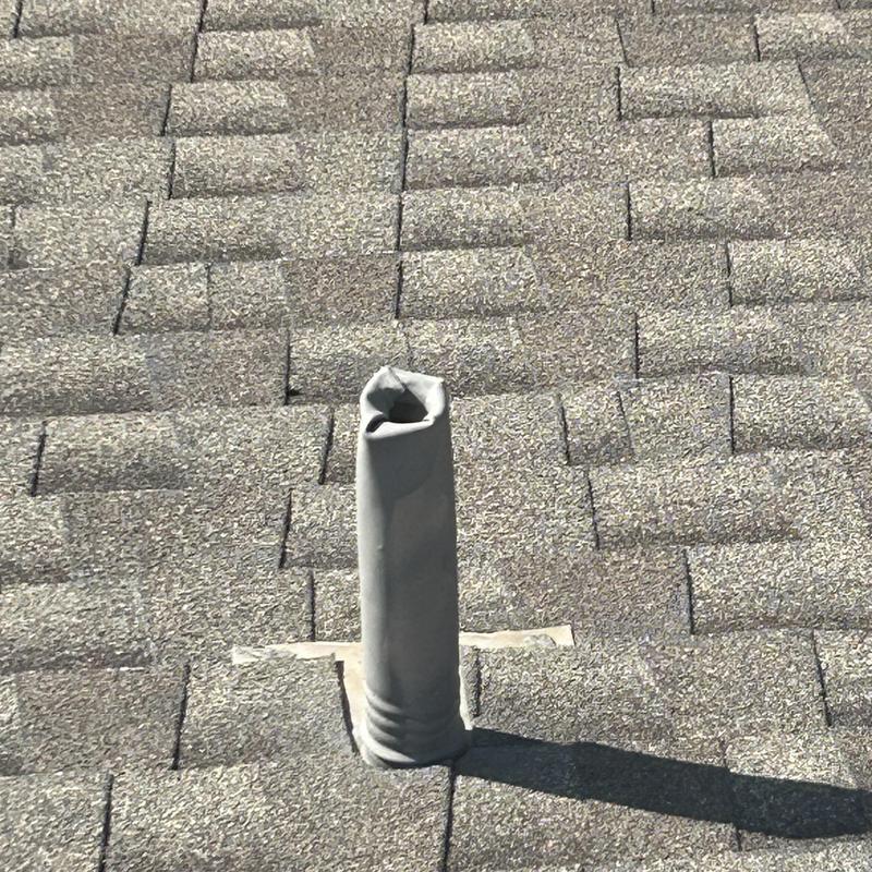 Roof vent pipe flashing on asphalt shingle roof