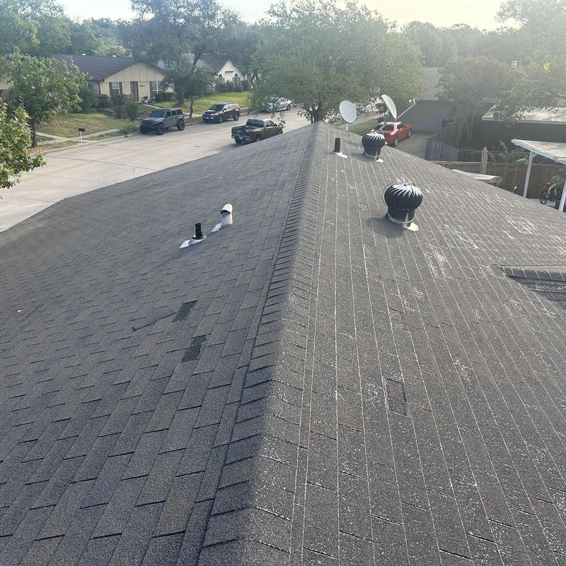 Asphalt shingle roof with vents and satellite dishes