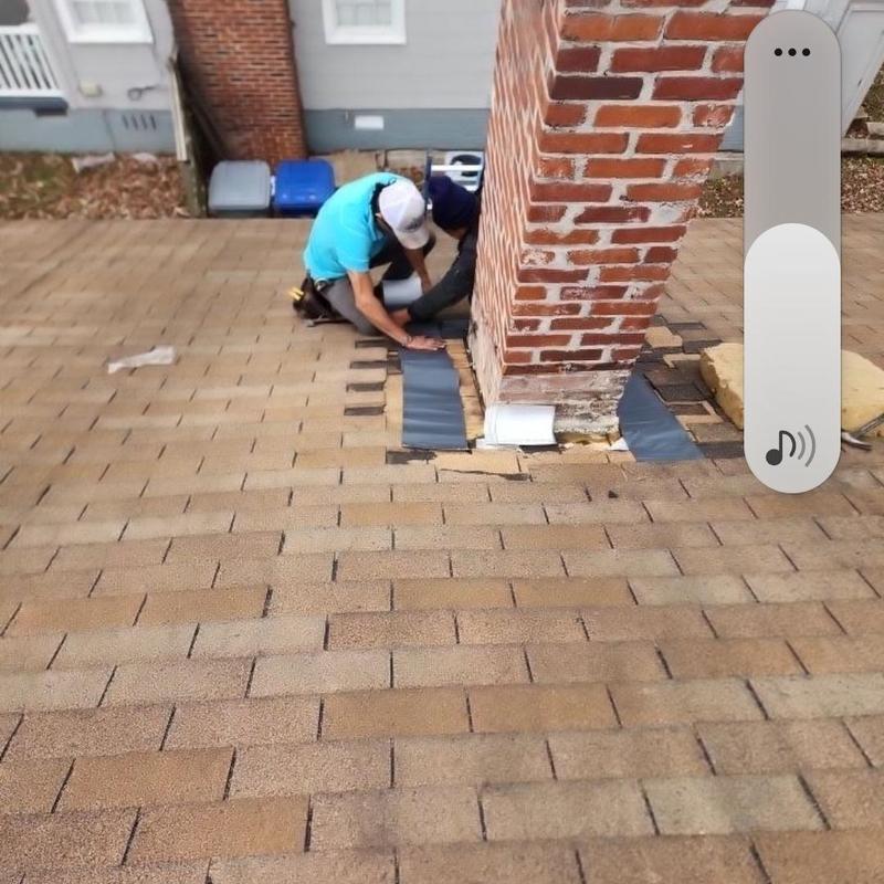 Chimney flashing installation on residential roof
