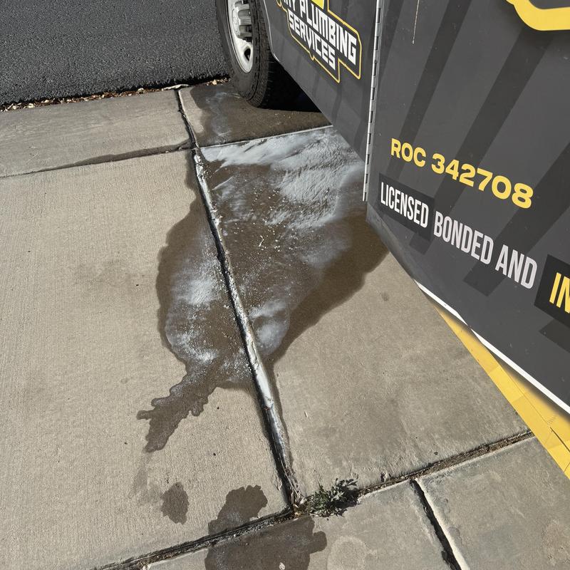 Water heater calcium buildup draining runoff on driveway Water heater calcium buildup draining runoff on driveway