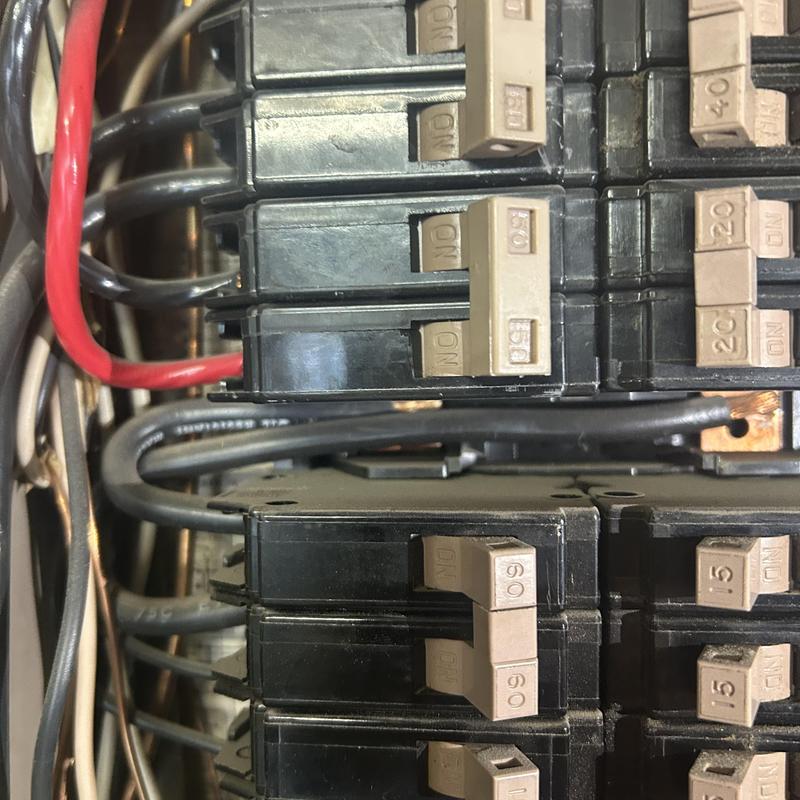 Split bus electrical panel breakers and wiring close-up Split bus electrical panel breakers and wiring close-up