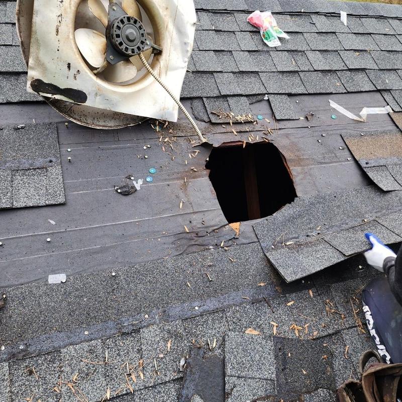 Roof shingles around hole with exhaust fan removal
