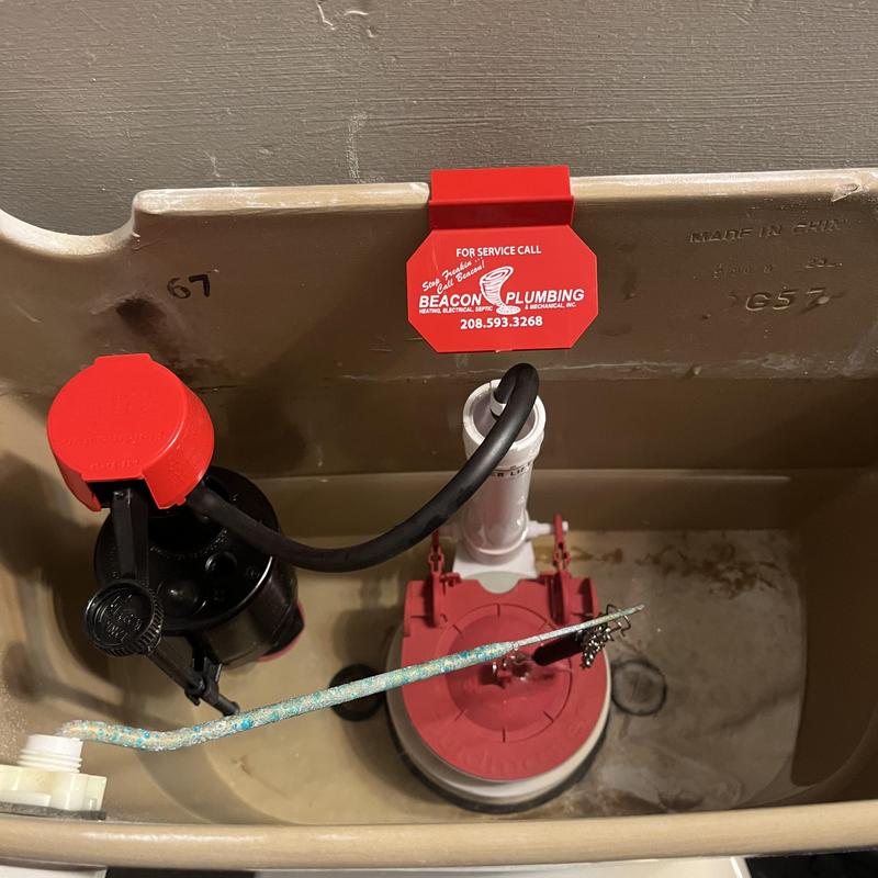 Toilet flush valve and fill valve installation inside tank