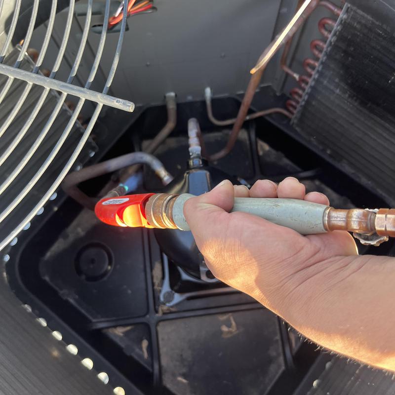 AC compressor hose connection during replacement in Chicago