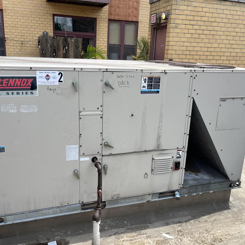 Commercial rooftop HVAC unit at clinic exterior