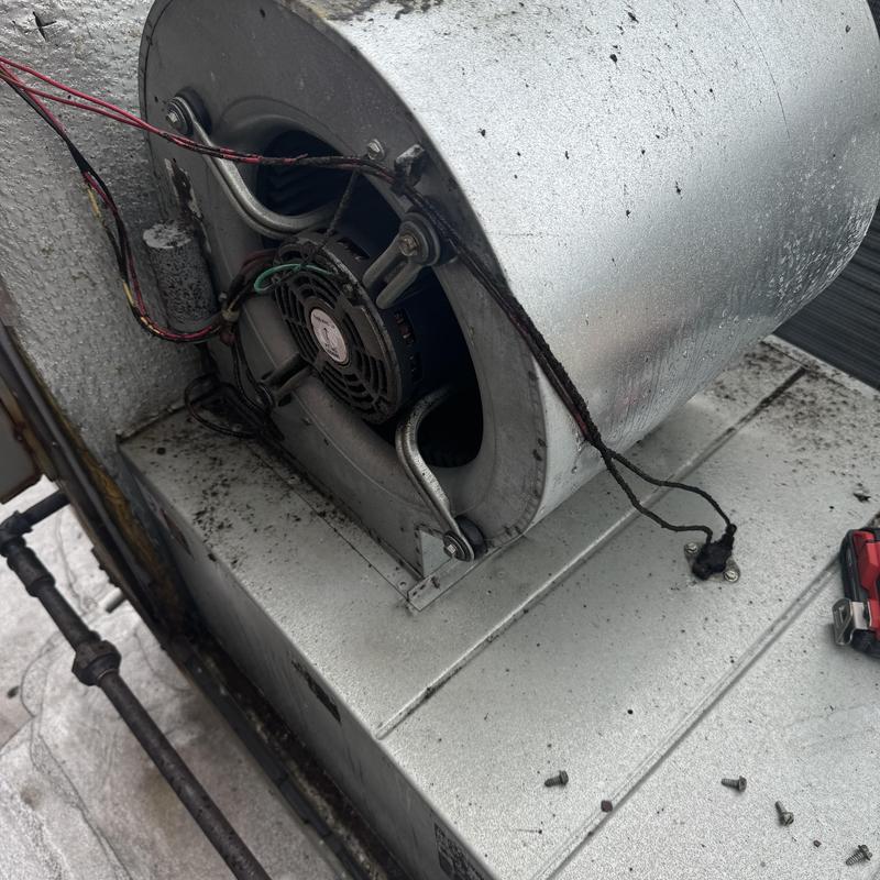 Blower motor with damaged wiring on HVAC unit