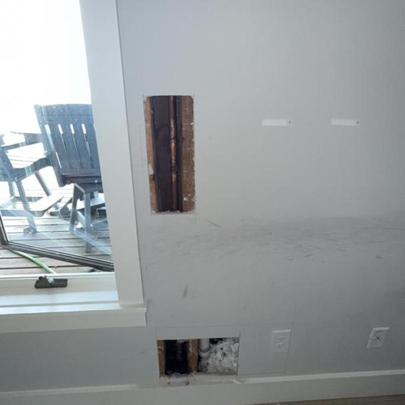 Leaking copper pipe in wall with drywall openings